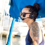 Picture of woman wearing 2Talk Headset for boating. Perfect communication device for anchoring.