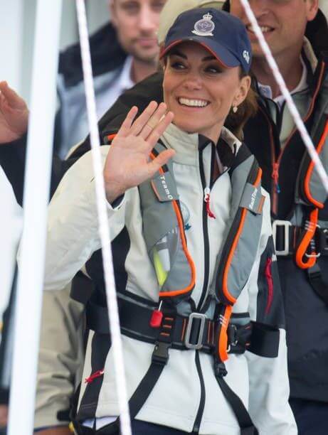 TeamO Marine PFD 275N BackTow™ Ocean Inflatable PFD in grey worn by a smiling individual.