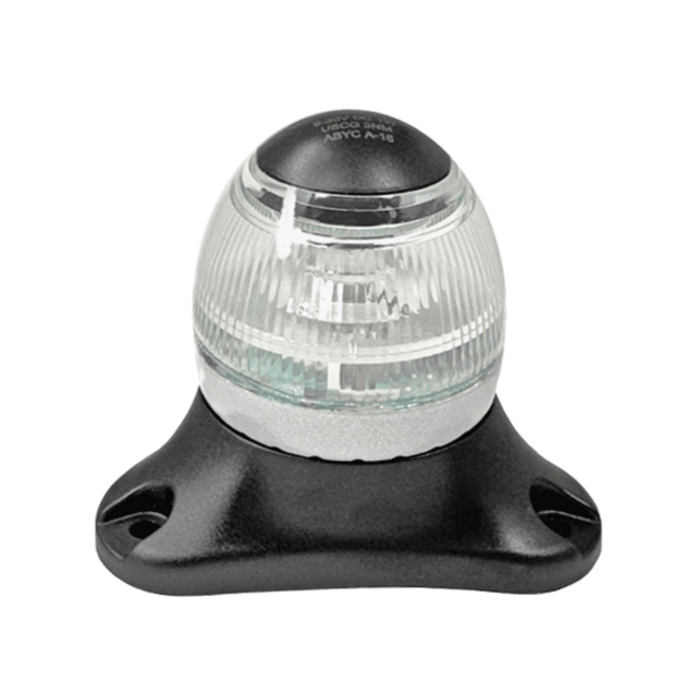 sideview of light showing black base and top with clear lens round light.