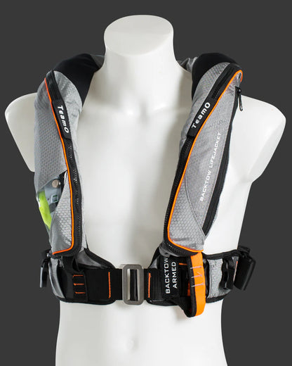 Gray and black TeamO Offshore pro sensor PFD with backtow  harness with orange accents on a mannequin against a dark background