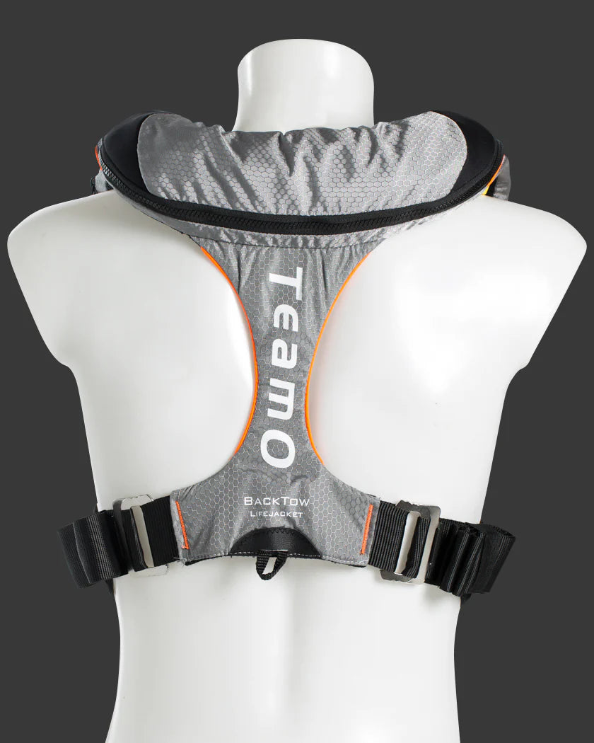TeamO Offshore pro sensor PFD in with backtow teachnology, including  2 crotch straps Gray backpack with black straps on a mannequin against a dark background