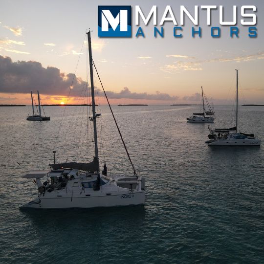 Several boats anchored with the security and confidence offered by Mantus anchors, the favorites of sailors