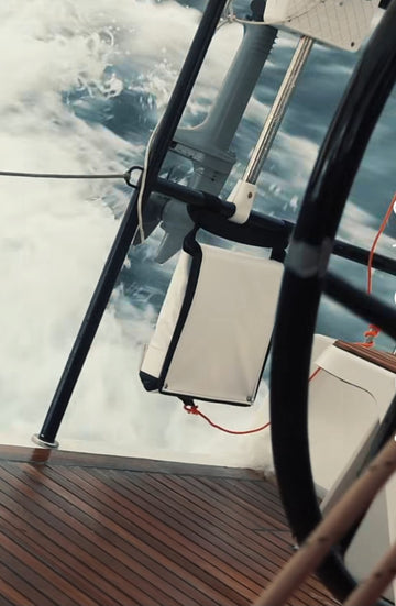 An 11  step emergency ladder on the back of a sailboat tied to the lifeline