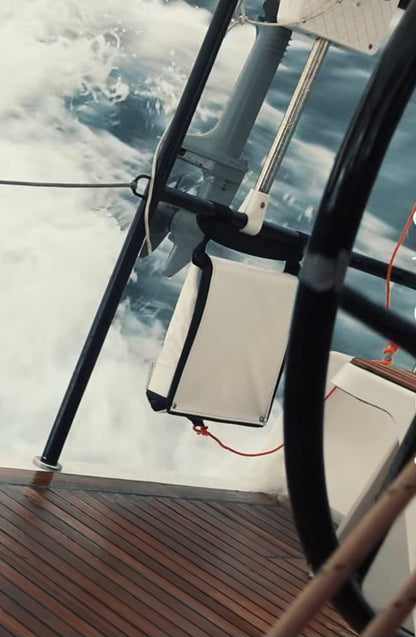 An 11  step emergency ladder on the back of a sailboat tied to the lifeline