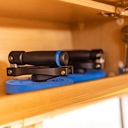 Folding winch handle EasySea on a wooden shelf, showcasing its compact design and innovative foldable feature.